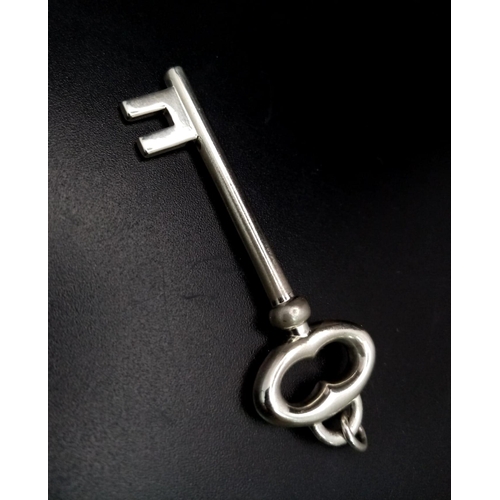 960 - A TIFFANY & CO SOLID SILVER KEY PENDANT.  9.3gms    5cms             ref 11846