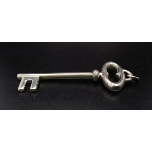 960 - A TIFFANY & CO SOLID SILVER KEY PENDANT.  9.3gms    5cms             ref 11846