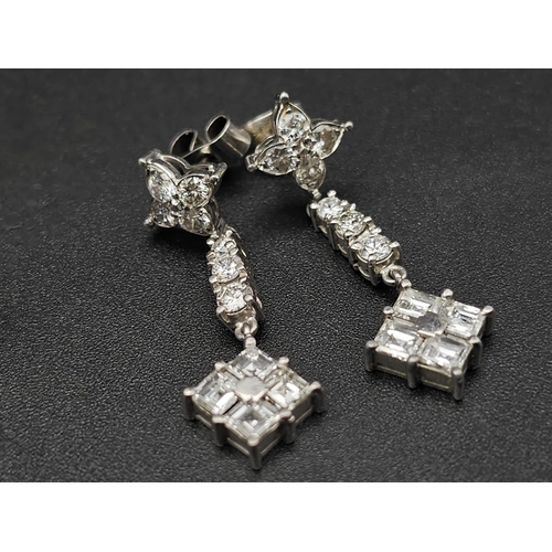 162 - A SUPERB PAIR OF DIAMOND DROP EARRINGS SET IN PLATINUM .  4.6gms   3cms DROP     ref 13069