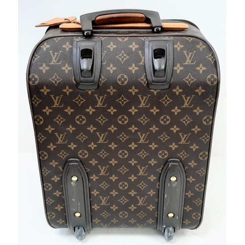 26 - A Louis Vuitton Monogram Canvas Hand Luggage Suitcase. Leather trim and handle. Large open exterior ... 