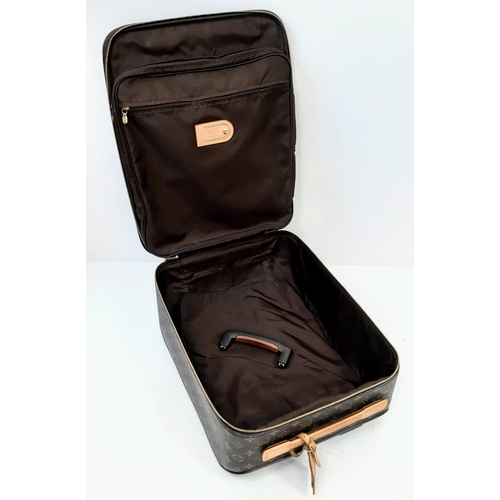 26 - A Louis Vuitton Monogram Canvas Hand Luggage Suitcase. Leather trim and handle. Large open exterior ... 