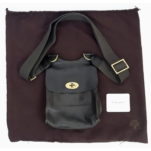 400 - A Mulberry Brown Leather Saddle Bag with Dust-Cover. Expandable shoulder strap. Gold-tone hardware. ... 