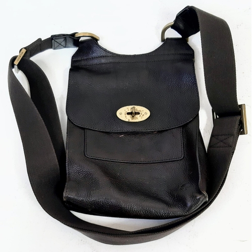 400 - A Mulberry Brown Leather Saddle Bag with Dust-Cover. Expandable shoulder strap. Gold-tone hardware. ... 