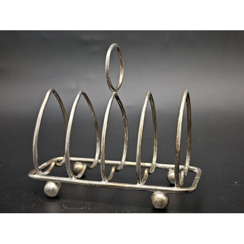 50 - Two Sterling Silver Toast Racks - Hallmarks for Sheffield 1926 and 1909. 137.5g total weight.