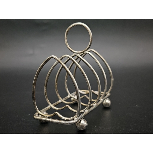 50 - Two Sterling Silver Toast Racks - Hallmarks for Sheffield 1926 and 1909. 137.5g total weight.