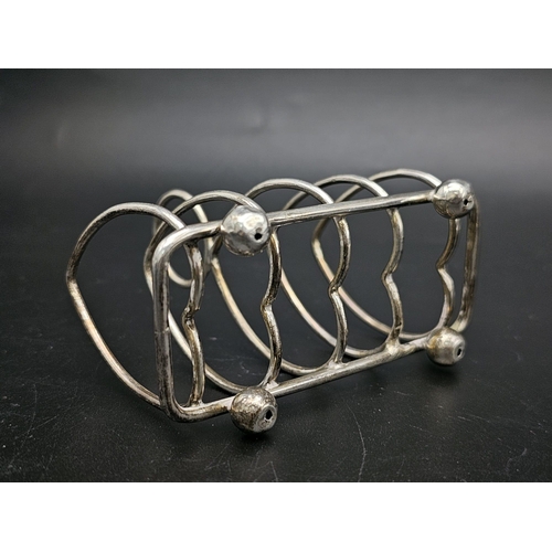 50 - Two Sterling Silver Toast Racks - Hallmarks for Sheffield 1926 and 1909. 137.5g total weight.