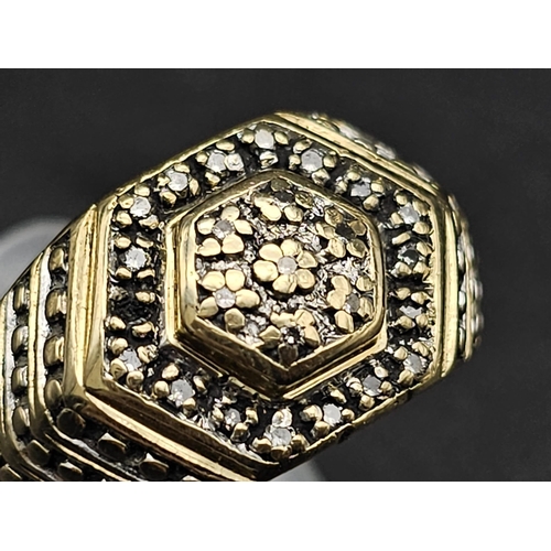 57 - A Vintage 9K Yellow Gold Diamond Ring. Double hexagonal 
decoration with 0.25ct of diamonds. Size W.... 