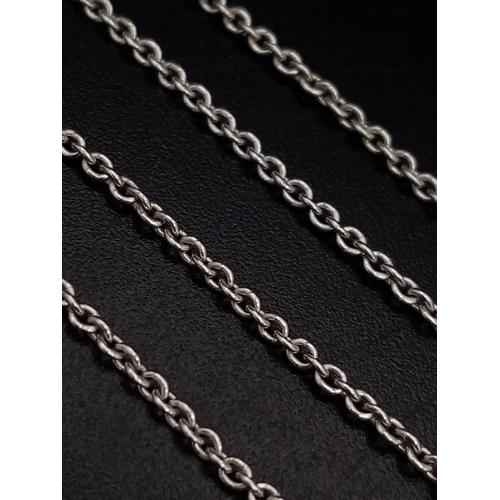 634 - A 9K WHITE GOLD PENDANT WITH A PEARL , HEART AND A CROSS CHARM ON A 40cms chain .   4.5gms    ref 90... 