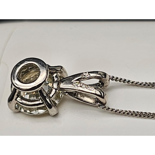 660 - .98ct DIAMOND PENDANT ON AN 18K  40cms GOLD CHAIN.   2.1gms