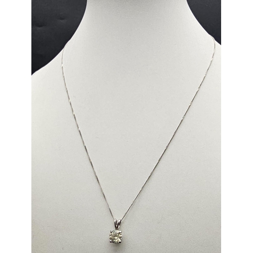 660 - .98ct DIAMOND PENDANT ON AN 18K  40cms GOLD CHAIN.   2.1gms