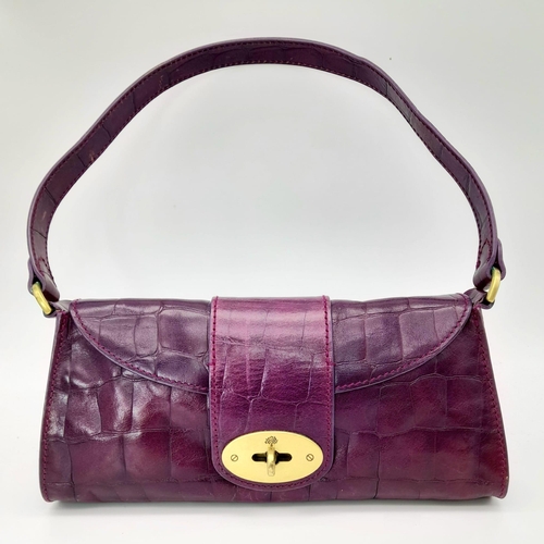 753 - A Mulberry Purple Leather Baguette Handbag. 24cm x 12cm.
Ref: 13004