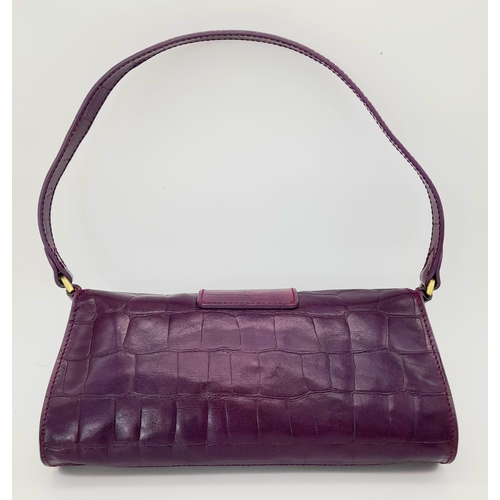 753 - A Mulberry Purple Leather Baguette Handbag. 24cm x 12cm.
Ref: 13004