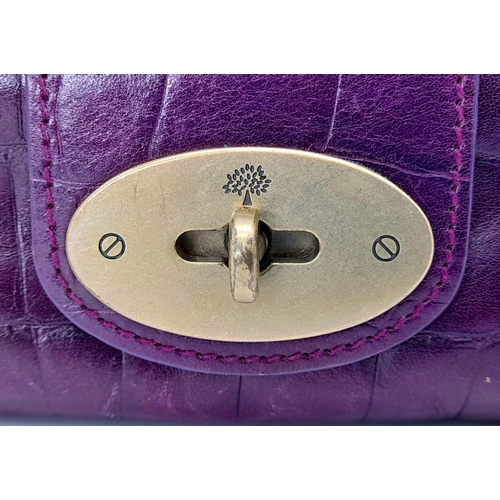 753 - A Mulberry Purple Leather Baguette Handbag. 24cm x 12cm.
Ref: 13004