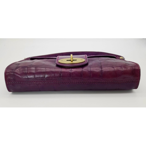 753 - A Mulberry Purple Leather Baguette Handbag. 24cm x 12cm.
Ref: 13004