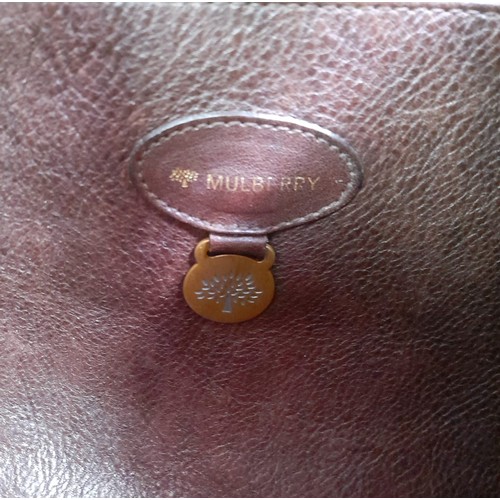 648 - A Mulberry Brown Leather Tote Bag with Dust-Cover. Gold-tone belt buckle decoration. Spacious interi... 