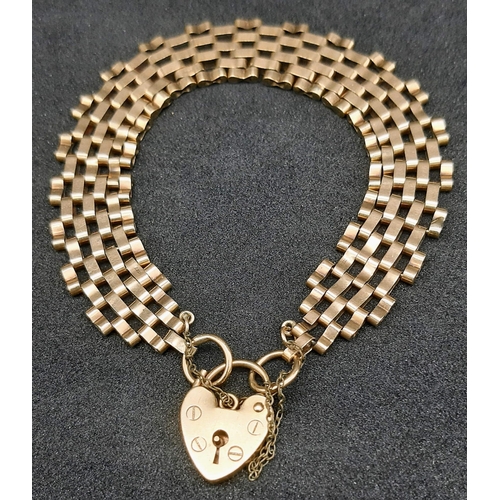 15 - A Vintage 9K Yellow Gold Gate Bracelet with Heart Clasp. 18cm. 13.3g