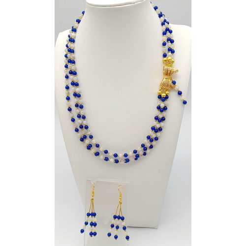 117 - A very feminine, necklace and earrings set consisting of three rows of modern Sri Lankan round blue ... 