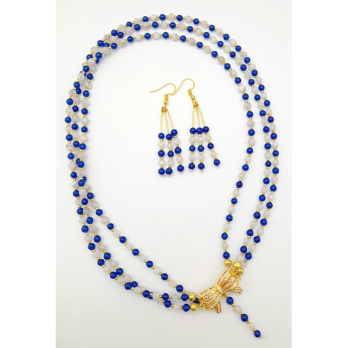 117 - A very feminine, necklace and earrings set consisting of three rows of modern Sri Lankan round blue ... 