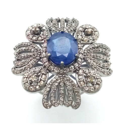 222 - A 10.75ct Blue Sapphire Gemstone Ring with 1.65ct Diamond Accents. Set in 925 Silver. Size N. 10.78g... 