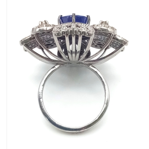 222 - A 10.75ct Blue Sapphire Gemstone Ring with 1.65ct Diamond Accents. Set in 925 Silver. Size N. 10.78g... 