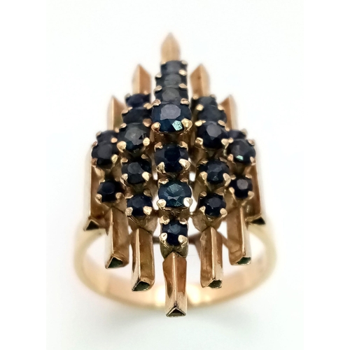 110 - A modernist, 14 K yellow gold ring with a crown of sapphires arranged on a group of proud standing p... 