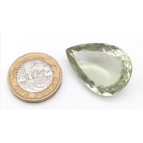 124 - A large (38.95 carats), green amethyst (often called Prasiolite ). Pear shaped in excellent conditio... 