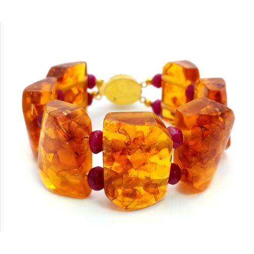 182 - An unusual bracelet with chunky amber and faceted rubies bracelet. Length: 19 cm, weight: 48 g, in a... 