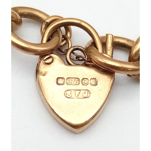 37 - A Vintage 9K Yellow Gold Charm Bracelet with Heart Clasp. Four charms. 16.3g total weight.