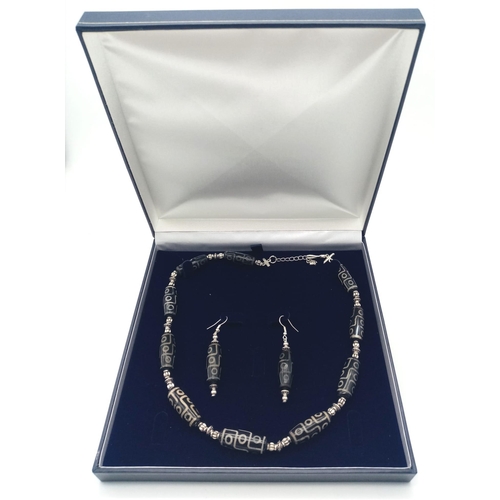 203 - A very collectable, Nepalese, nine eyed DZI necklace and earrings set. According to Tibetan Folklore... 