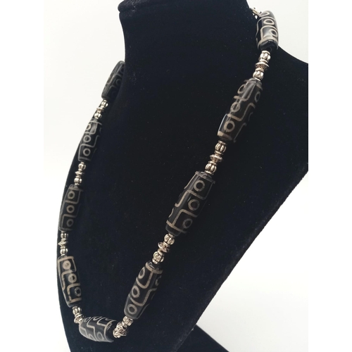 203 - A very collectable, Nepalese, nine eyed DZI necklace and earrings set. According to Tibetan Folklore... 