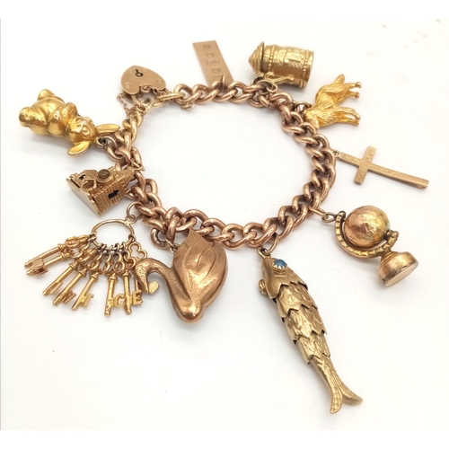 131 - A Vintage 9K Charm Bracelet with Gold Clasp. Ten charms including: Swan, Bunny and Articulated Fish!... 