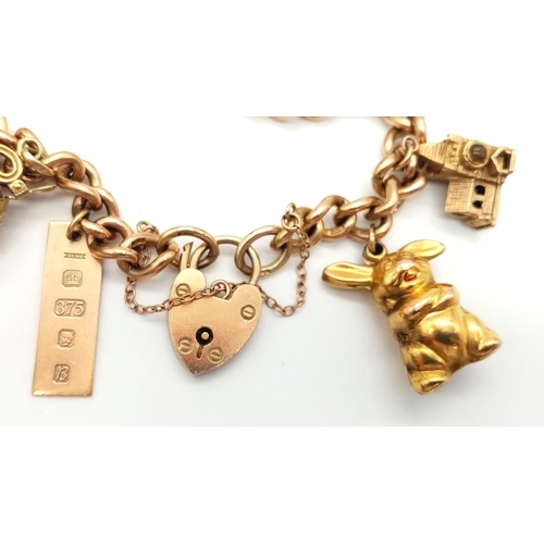 131 - A Vintage 9K Charm Bracelet with Gold Clasp. Ten charms including: Swan, Bunny and Articulated Fish!... 