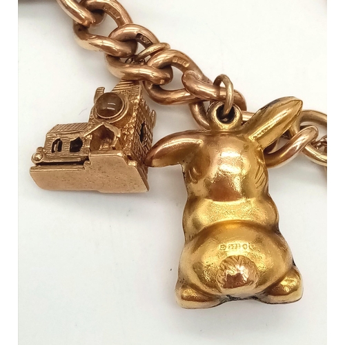 131 - A Vintage 9K Charm Bracelet with Gold Clasp. Ten charms including: Swan, Bunny and Articulated Fish!... 