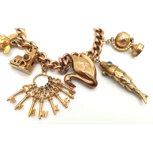 131 - A Vintage 9K Charm Bracelet with Gold Clasp. Ten charms including: Swan, Bunny and Articulated Fish!... 