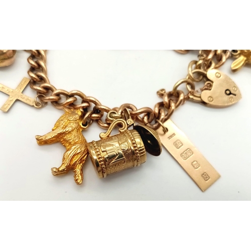 131 - A Vintage 9K Charm Bracelet with Gold Clasp. Ten charms including: Swan, Bunny and Articulated Fish!... 