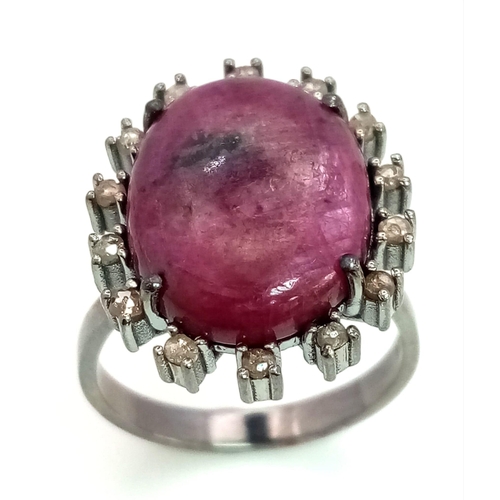198 - A 13.2ct Madagascan Oval Cut Ruby and Rose cut Diamond Surround Ring - 0.65ct. Set in 925 silver. Si... 