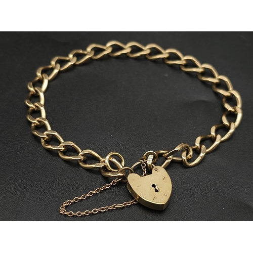 33 - 9K YELLOW GOLD CHARM BRACELET WITH PADLOCK CLASP AND SAFETY CHAIN, WEIGHT 11.5G