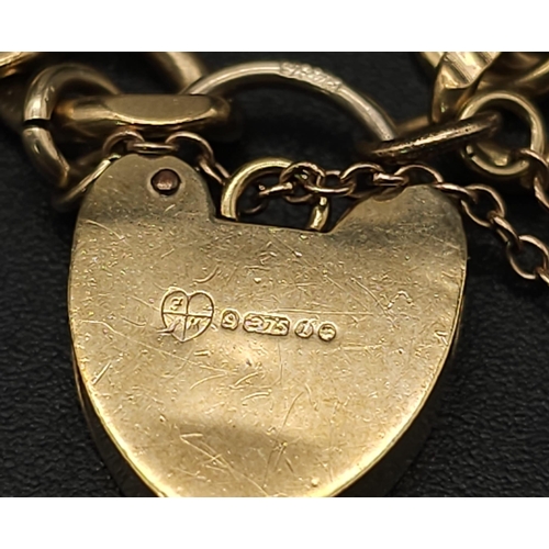 33 - 9K YELLOW GOLD CHARM BRACELET WITH PADLOCK CLASP AND SAFETY CHAIN, WEIGHT 11.5G