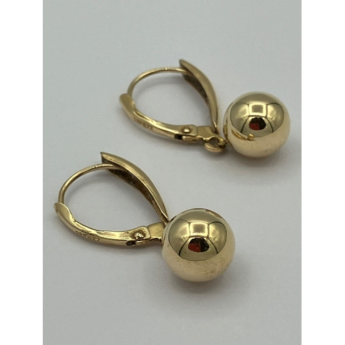 149 - Pair of 14 carat GOLD BOULES DROP EARRINGS. Complete with box. 1.25 grams. 2.5 cm Drop.