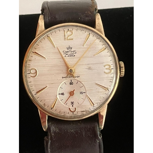 163 - Gentlemans Vintage 9 carat GOLD SMITHS DELUXE WRISTWATCH. 15 Jewels Manual winding. Having subsidiar... 