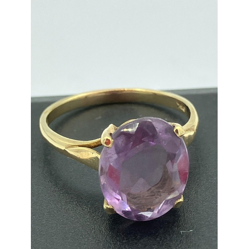 169 - Beautiful 2.8 carat oval cut AMETHYST set into a 9 carat YELLOW GOLD RING. Cathedral mounted in high... 