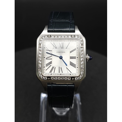 24 - A Cartier Santos Damont Watch. Black leather Cartier strap. Steel case - 32mm. Silver tone dial. Dia... 