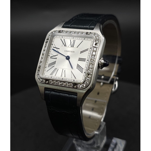 24 - A Cartier Santos Damont Watch. Black leather Cartier strap. Steel case - 32mm. Silver tone dial. Dia... 