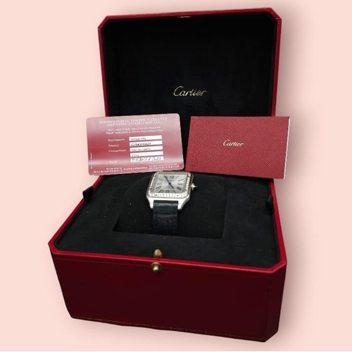 24 - A Cartier Santos Damont Watch. Black leather Cartier strap. Steel case - 32mm. Silver tone dial. Dia... 