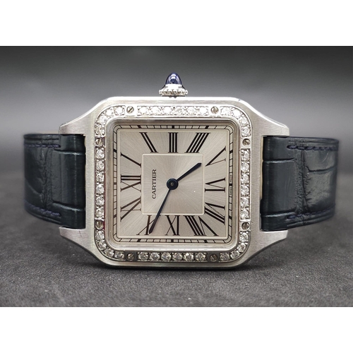 24 - A Cartier Santos Damont Watch. Black leather Cartier strap. Steel case - 32mm. Silver tone dial. Dia... 