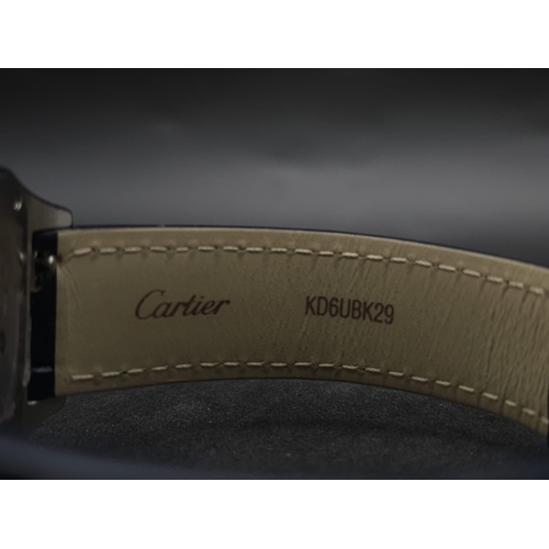 24 - A Cartier Santos Damont Watch. Black leather Cartier strap. Steel case - 32mm. Silver tone dial. Dia... 