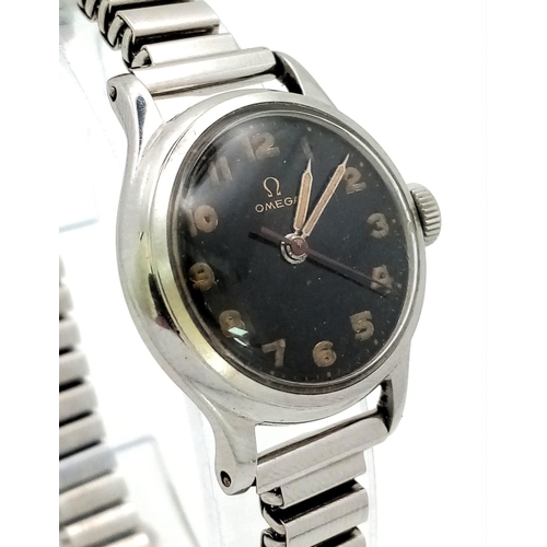 79 - A 1950s Omega Mechanical Ladies Watch. Expandable steel bracelet. Steel case - 24mm. Black dial with... 