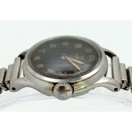 79 - A 1950s Omega Mechanical Ladies Watch. Expandable steel bracelet. Steel case - 24mm. Black dial with... 