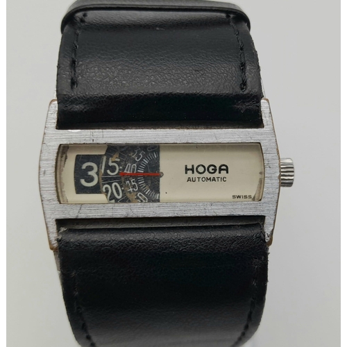 65 - A Rare Vintage Hoga Directime Automatic Gents Jump Watch. Black leather strap. Stainless steel case ... 