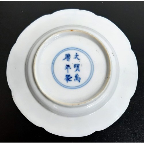 141 - An Early Chinese Small Lobed Octagonal Blue and White Plate. Kang hsi period with Ming reign mark. 1... 